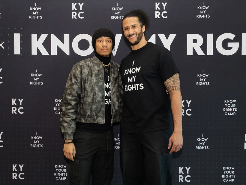 Cayden Brown stands with Colin Kaepernick after becoming his youngest KYRC speaker
